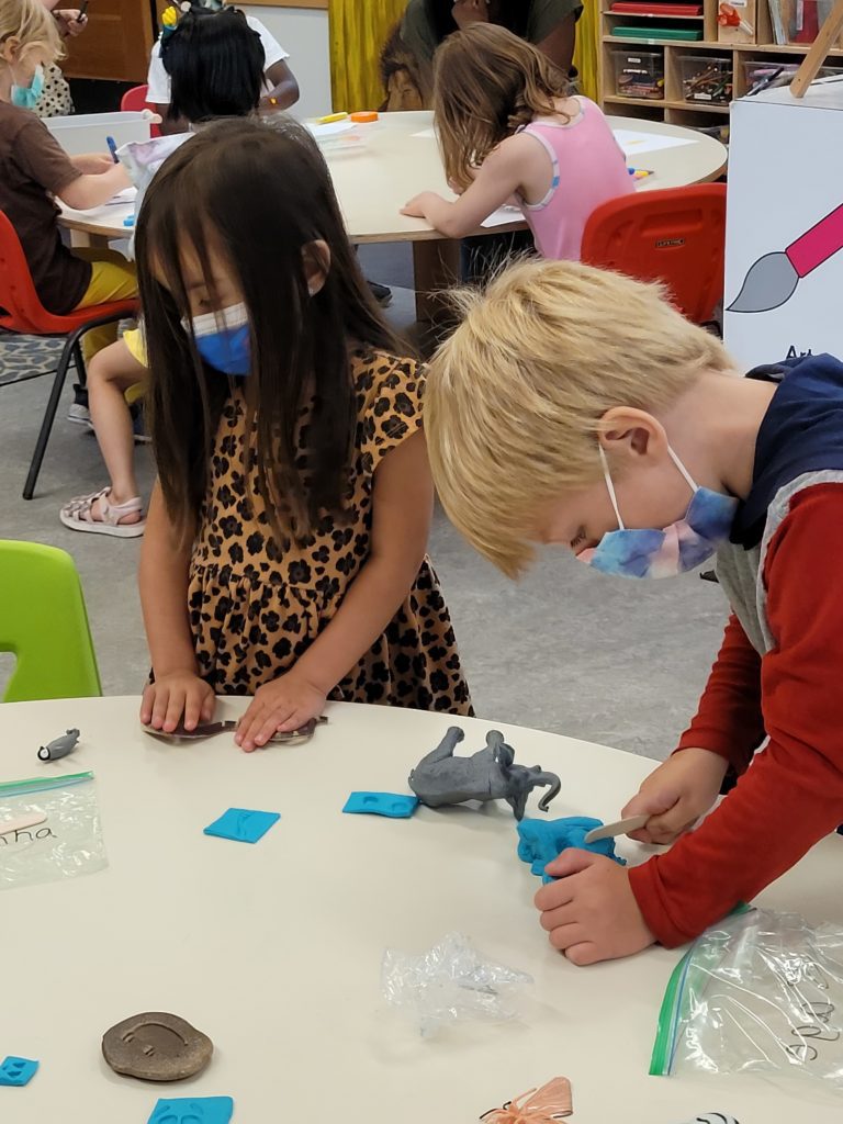 Preschoolers at Creative Kids Learning Center at Carkeek Park do hands-on projects in preparation for an upcoming trip to Woodland Park Zoo (August 2022). 
