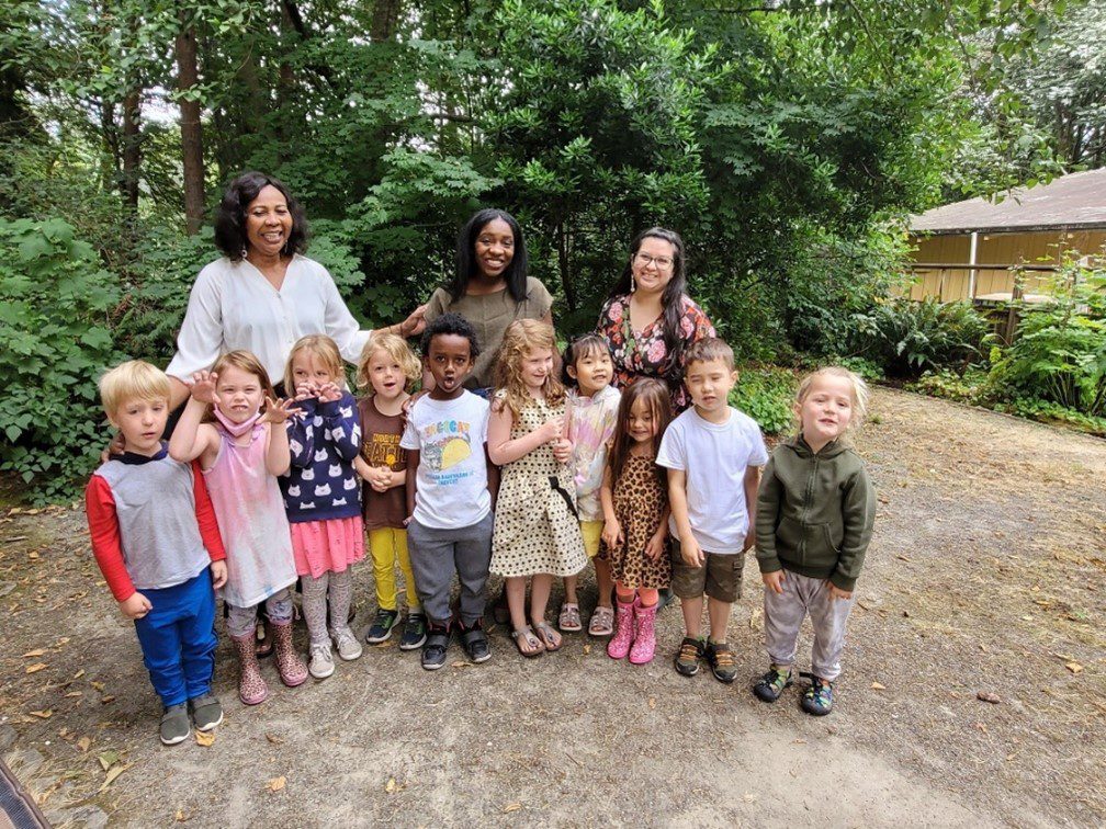 Creative Kids Director Grace Alam (L) and SPP teachers D’Onna Smith (center) and Amanda Benjamin (R) with their class of preschoolers.  