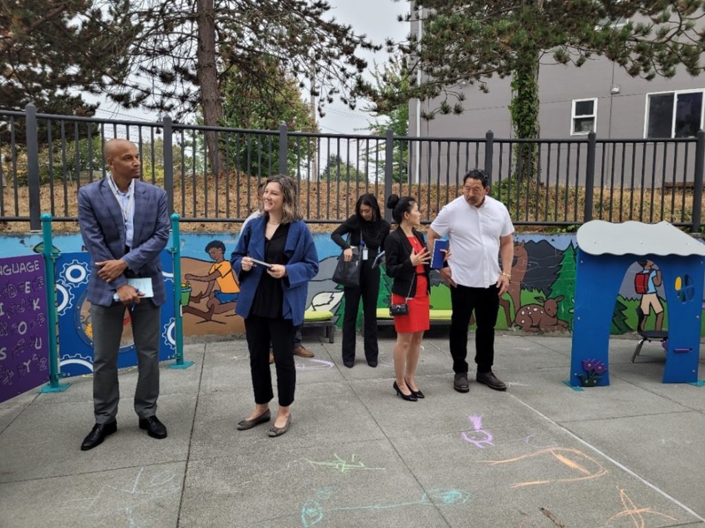 Director Dwane Chappelle (L) joins LOC Member and Seattle Education President Jennifer Matter (second from left) in observing play-based learning at the Seattle Preschool Program at Rising Star Elementary, while Principal Huyen Lam (second from right) shares about the program with Mayor Bruce Harrell (R). Also pictured is Mayor’s Office External Affairs Liaison Crystal Chindavongsa (center).  